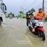 Aksi Sukarelawan Brigade Penolong 13.29 Kwarcab Sumenep Pada  Bencana Banjir Sumenep