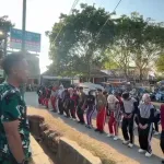 Penuh Disiplin, Pasukan Pengibar Hari Santri di Arjasa Bersiap Kibarkan Merah Putih